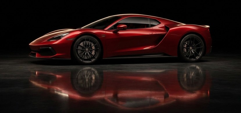 Red supercar under studio light in a dark showroom